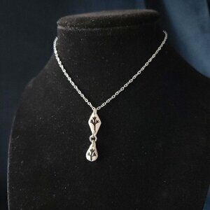 Gothic whimsigoth silver witch flower necklace with a small silver chain